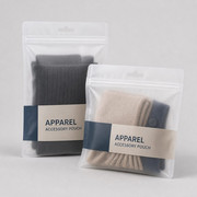 Frosted small apparel accessory pouches with hang holes and folded knit goods inside