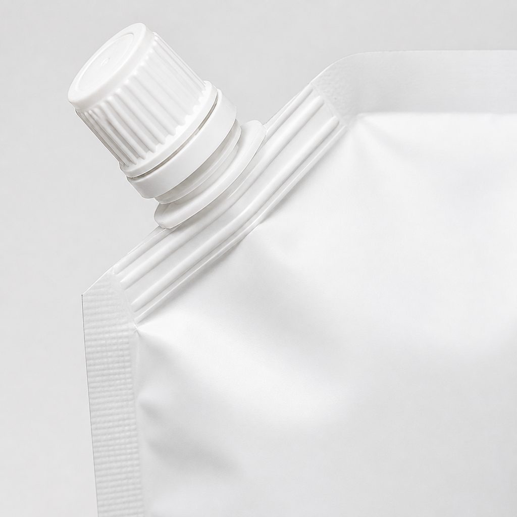 Close-up corner spout pouch fitment with screw cap and sealed shoulder