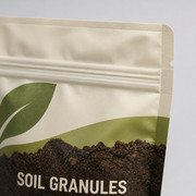 Printed agricultural granule pouch with heat seal, tear notch, and resealable zipper detail