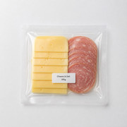 Sliced cheese and salami in a clear vacuum pack with a Cheese and Deli 180g label