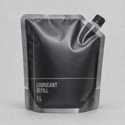 Reinforced charcoal lubricant refill pouch with upper-right corner spout for industrial liquid dispensing