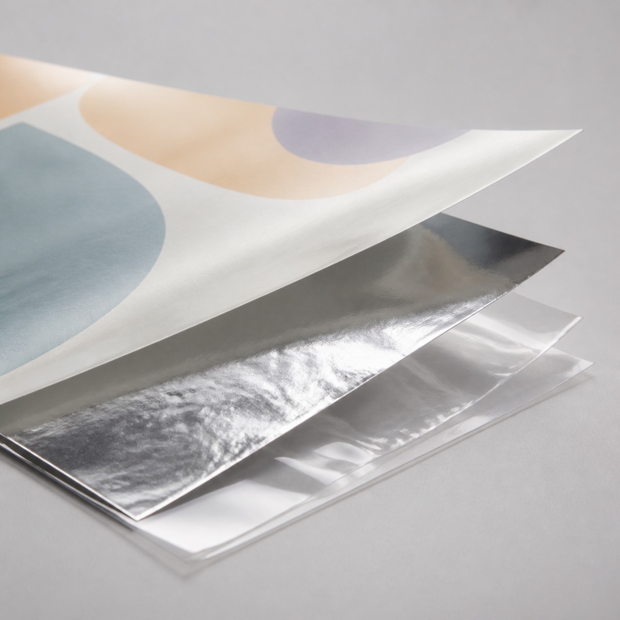 Foil laminate material structure with metallic barrier and sealant film layers