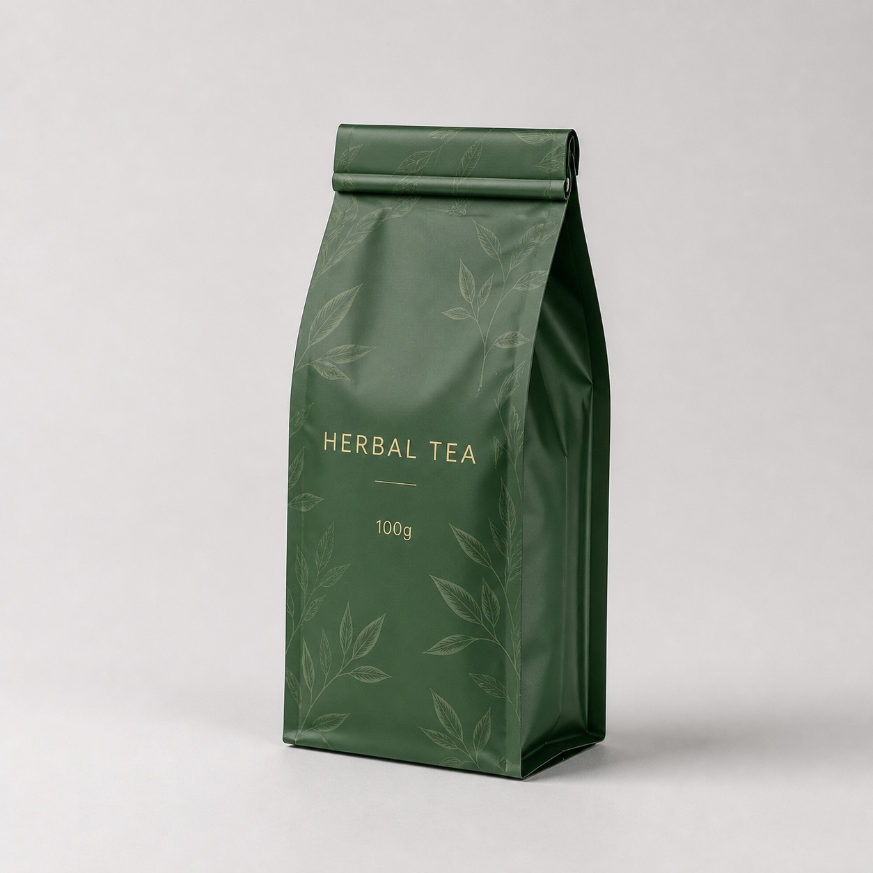 Upright green herbal tea side-gusset roll-fold pouch with visible side panel and folded top